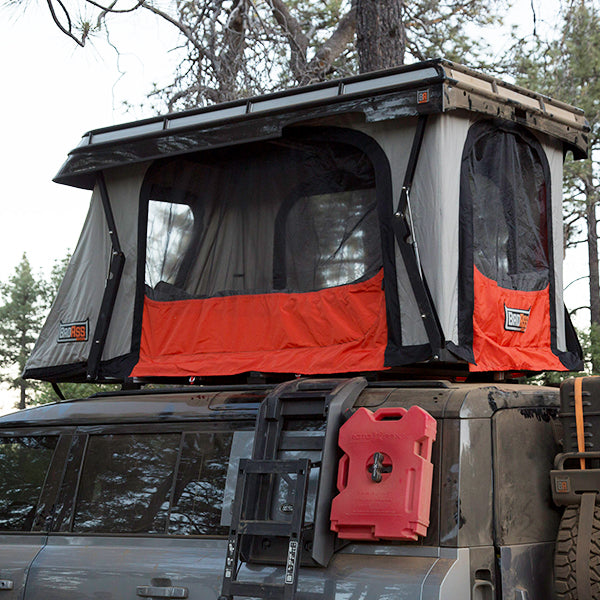 Badass Tents "CONVOY" 2020-23 Land Rover NEW Defender 110 Rooftop Tent PRE-. Close up of open tent on vehicle showing windows and door