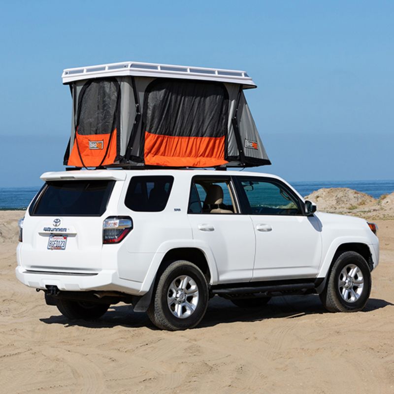 Badass Tents "CONVOY" Toyota 4Runner 09-23' (5th Gen) Rooftop Tent - PRE-ASSEMBLED. Rear angled view of Open tent on vehicle on beach