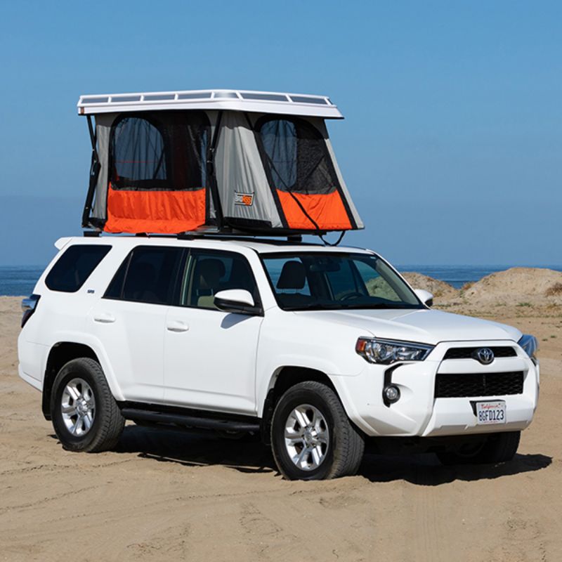 Badass Tents "CONVOY" Toyota 4Runner 09-23' (5th Gen) Rooftop Tent - PRE-ASSEMBLED. Front angled view of Open tent on vehicle on beach