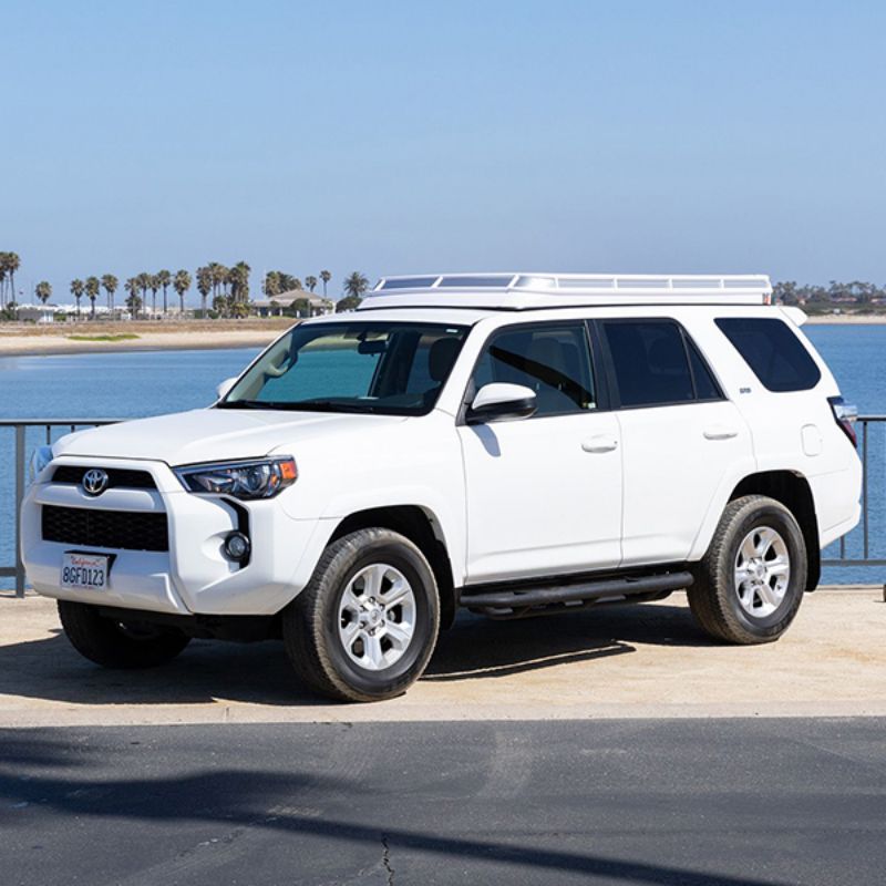 Badass Tents "CONVOY" Toyota 4Runner 09-23' (5th Gen) Rooftop Tent - PRE-ASSEMBLED.Front angled view of closed tent on vehicle outside