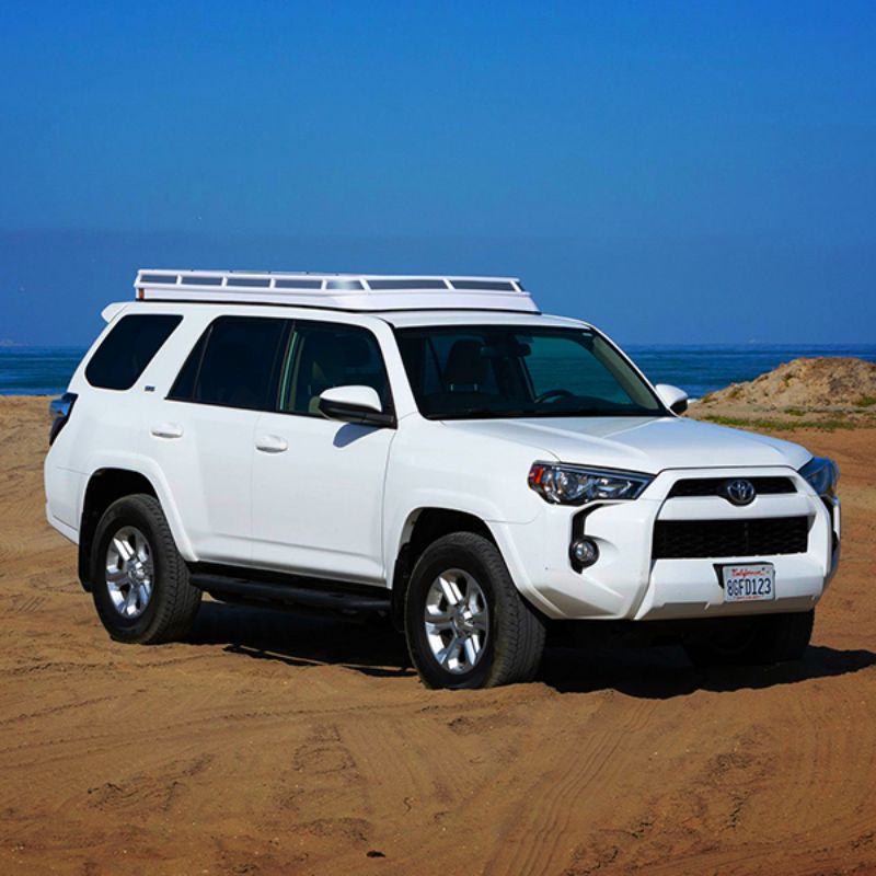 Badass Tents "CONVOY" Toyota 4Runner 09-23' (5th Gen) Rooftop Tent - PRE-ASSEMBLED. Closed tent on vehicle on beach