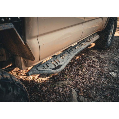 Backwoods Adventure Mods Rock Sliders for Toyota Tacoma 2nd & 3rd Gen (2005-2023) close up view installed on truck