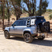 Badass Tents "CONVOY" 2020-23 Land Rover NEW Defender 110 Rooftop Tent PRE-ASSEMBLED. Drivers side view of closed tent on vehicle outside