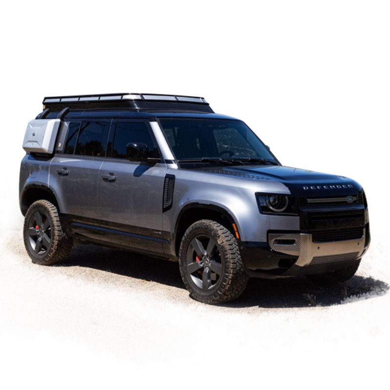 Badass Tents "CONVOY" 2020-23 Land Rover NEW Defender 110 Rooftop Tent PRE-ASSEMBLED. Front corner view of closed tent on vehicle on white background