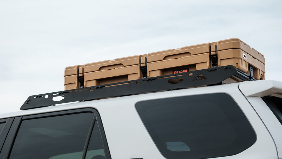 The Needle (2010-2023 4Runner Half Roof Rack) Side angled view of rack on vehicle holding items