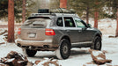 Porsche Cayenne Roof Rack Rear corner wide view of rack with equipment on vehicle outside