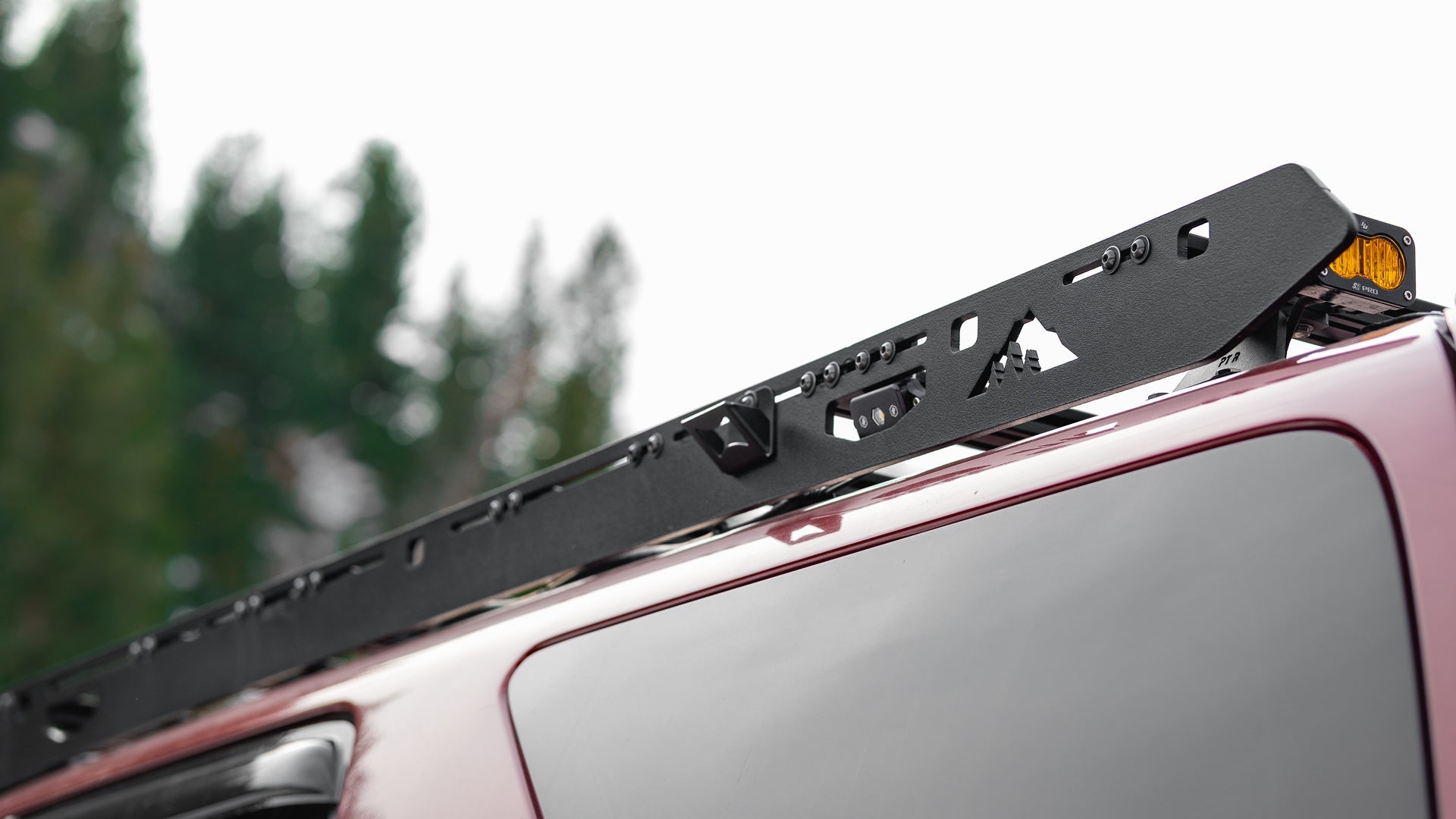 4th Gen Toyota 4Runner Roof Rack Rear side close up of rack on vehicle outside showing Sherpa logo