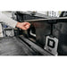 DECKED Truck Bed Drawer System for Jeep Gladiator man's hand ready to open installed drawer outdoors