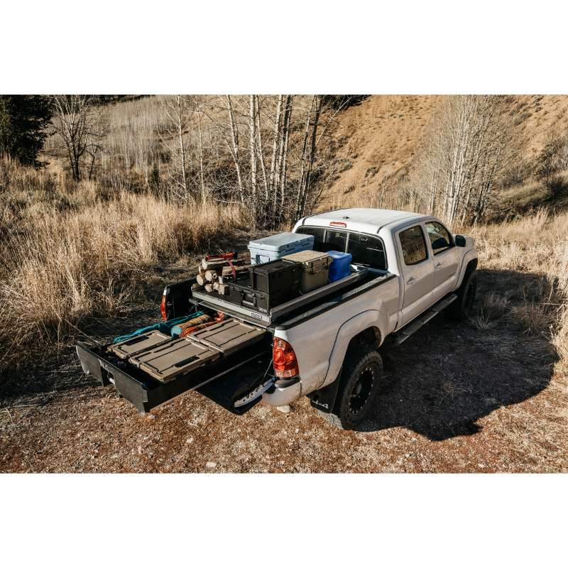 DECKED Truck Bed Drawer System for Nissan Trucks top view of open drawer with bins installed outdoors