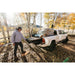 DECKED Truck Bed Drawer System for Jeep Gladiator man using open drawer with bins installed in truck outdoors