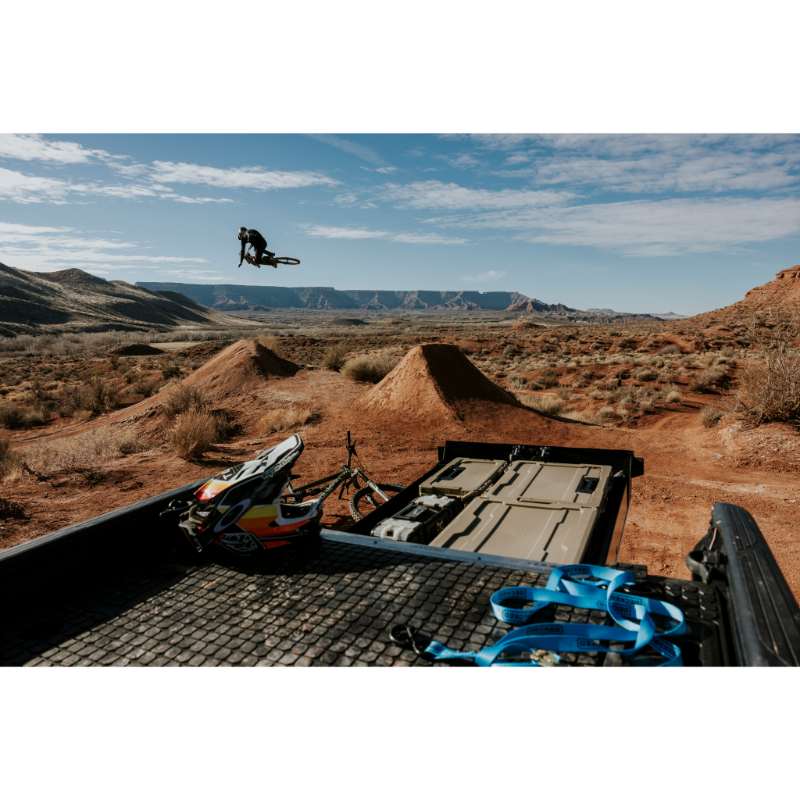 DECKED Truck Bed Drawer System for Jeep Gladiator open drawer with bins installed in truck outdoors with scenic view