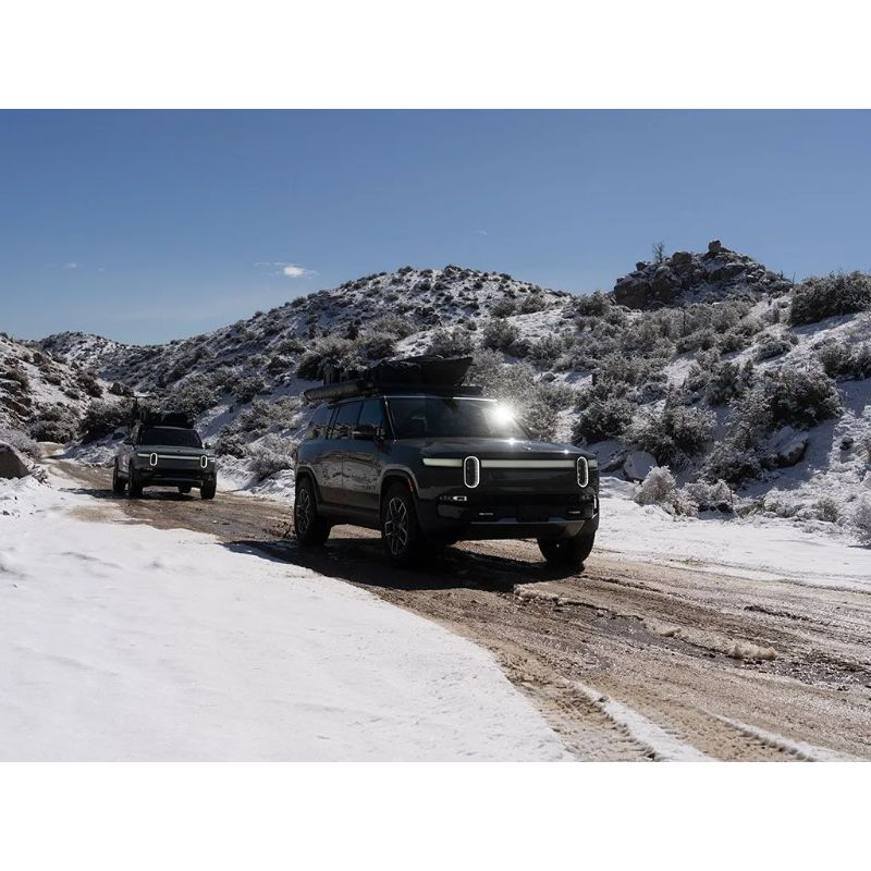 Front Runner Slimline II Rivian R1S on cars through snow