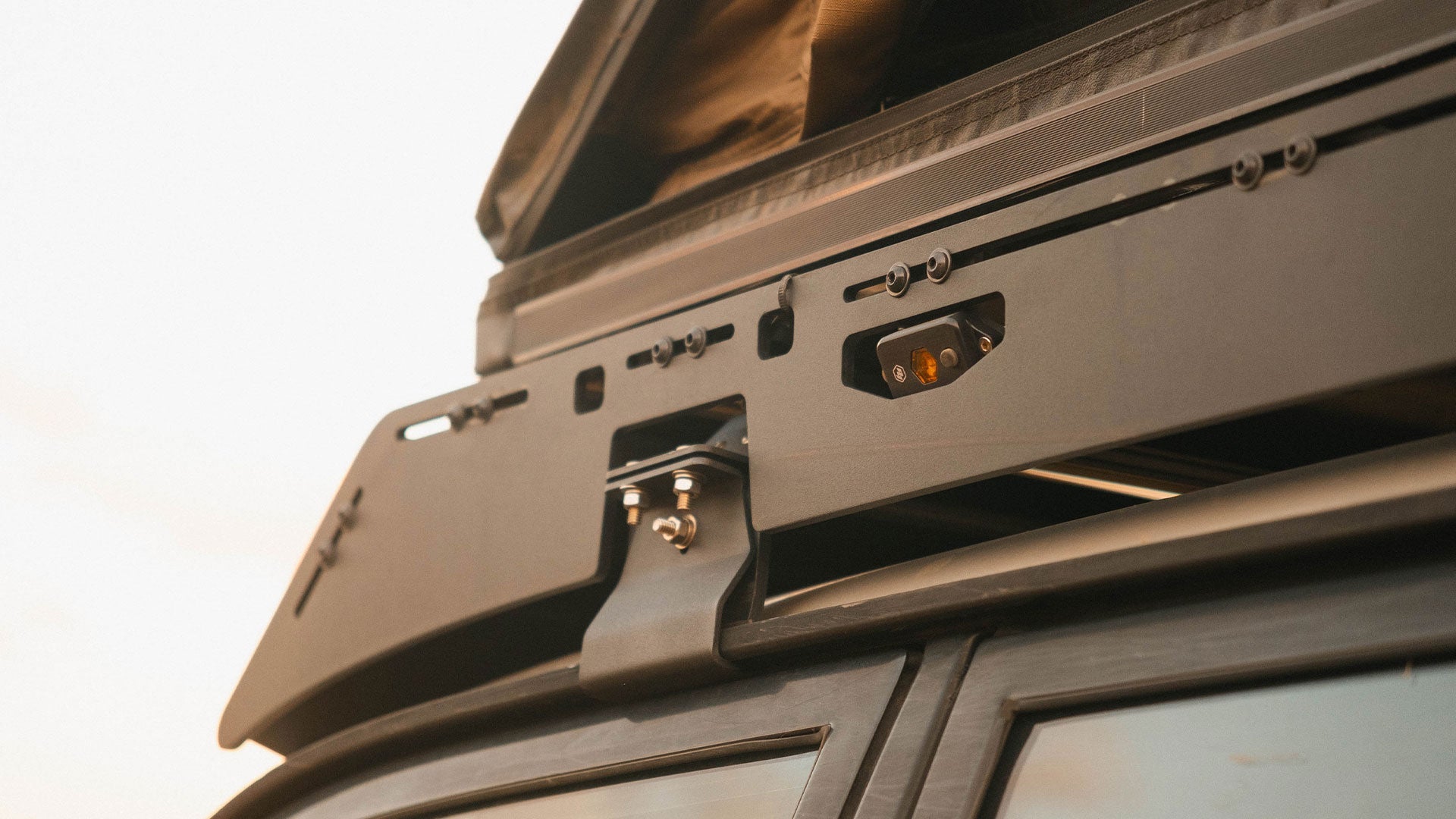 80 Series Landcruiser Roof Rack Close up view of rack attachment with tent 