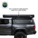 Overland Vehicle Systems XD Nomadic 270 Degree Awning & Wall Kit Combo with Lights, Black Out, Black Body , Trim, And Travel Cover closed side view on white background