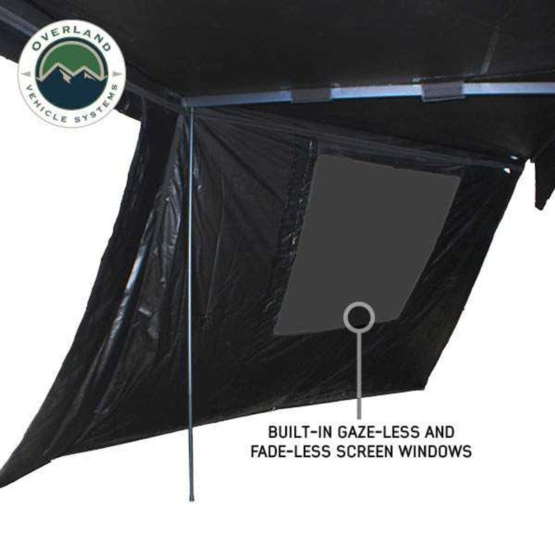 Overland Vehicle Systems XD Nomadic 270 Degree Awning & Wall Kit Combo with Lights, Black Out, Black Body , Trim, And Travel Cover showing windows on white background