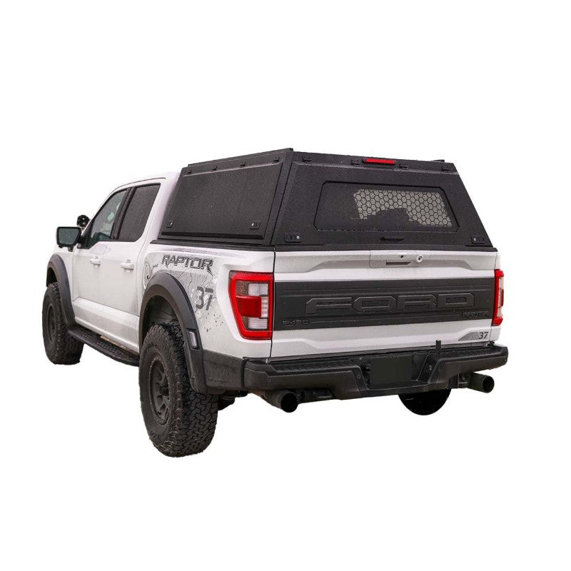 Overland Vehicle Systems "Expedition" Truck Cap with Full Wing Doors, Front And Rear Windows & 3rd Brake Light rear view on expedition