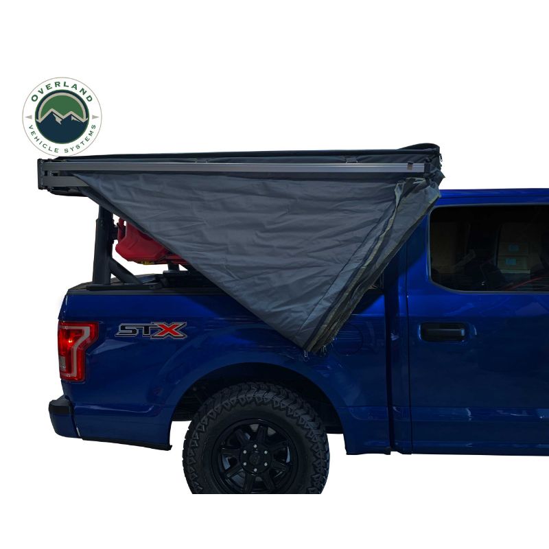 Overland Vehicle Systems Nomadic 270 LT Awning - Passenger Side - Dark Gray With Black Cover side view on vehicle on white background
