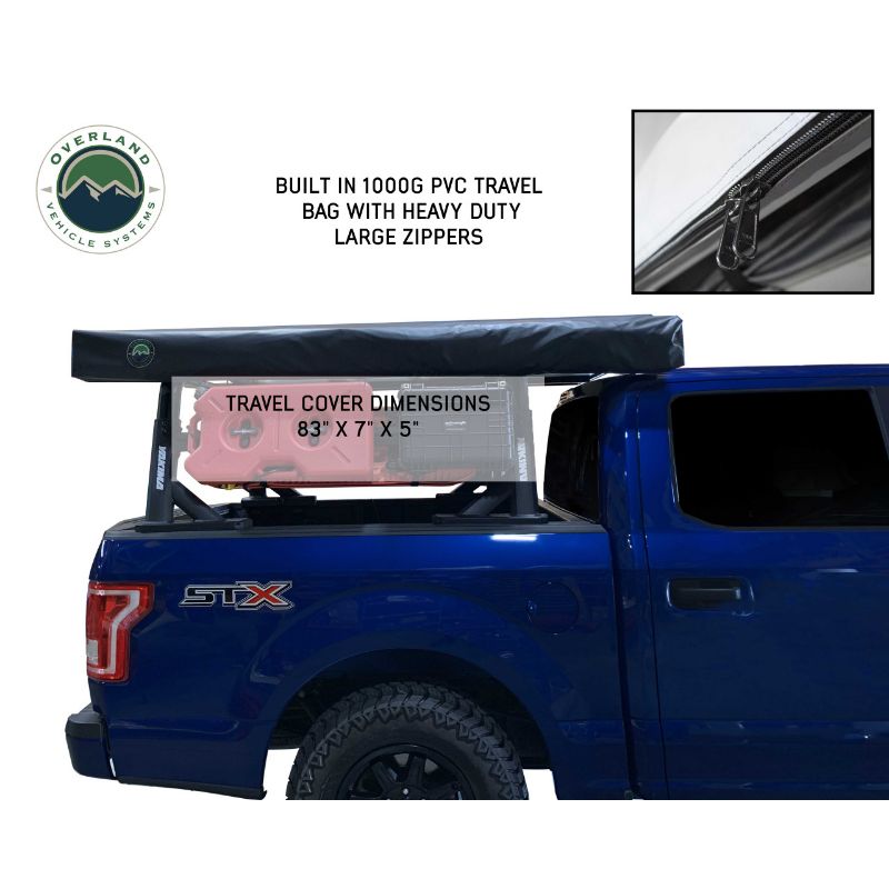 Overland Vehicle Systems Nomadic 270 LT Awning - Passenger Side - Dark Gray With Black Cover side view on vehicle closed on white background