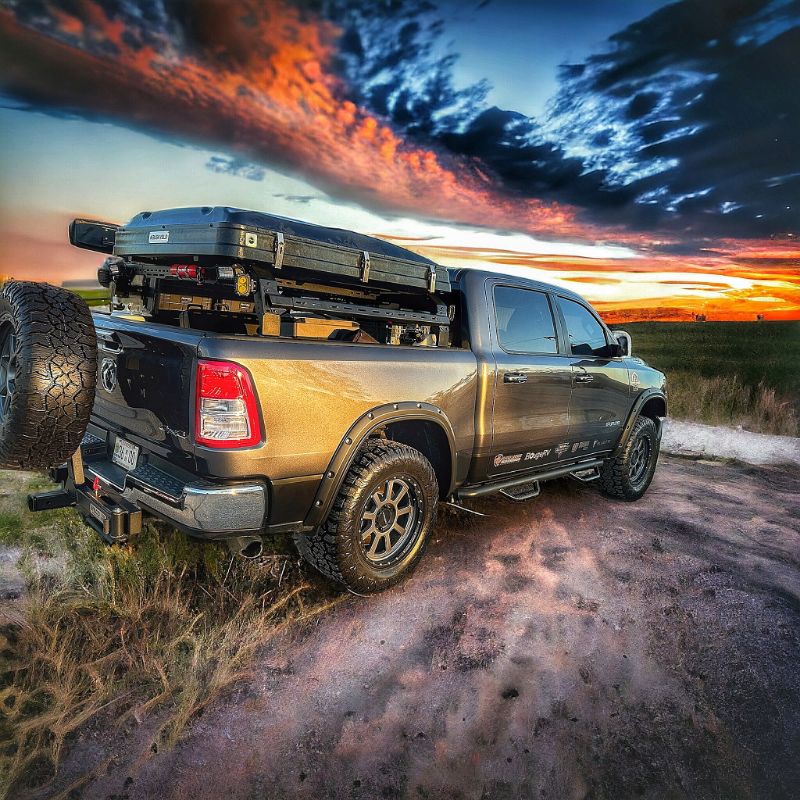 RAM 1500 SHIPROCK Mid Rack System MIDRACK TUWA PRO®️ rear corner view installed on truck outdoors at sunset