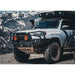 Backwoods Adventure Mods Hi-Lite Overland Front Bumper [Bull Bar] for Toyota 4Runner (5th Gen) Corner view of attached bumper on vehicle on mountain