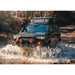 Backwoods Adventure Mods Hi-Lite Overland Front Bumper [Bull Bar] for Toyota 4Runner (5th Gen) View of bumper attached to vehicle moving through puddle