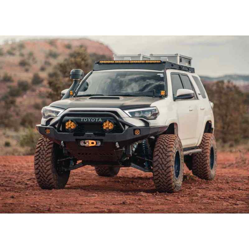 Backwoods Adventure Mods Hi-Lite Overland Front Bumper [PreRunner Bull Bar] for Toyota 4Runner (5th Gen) Wide view of bumper attached to vehicle in dirt