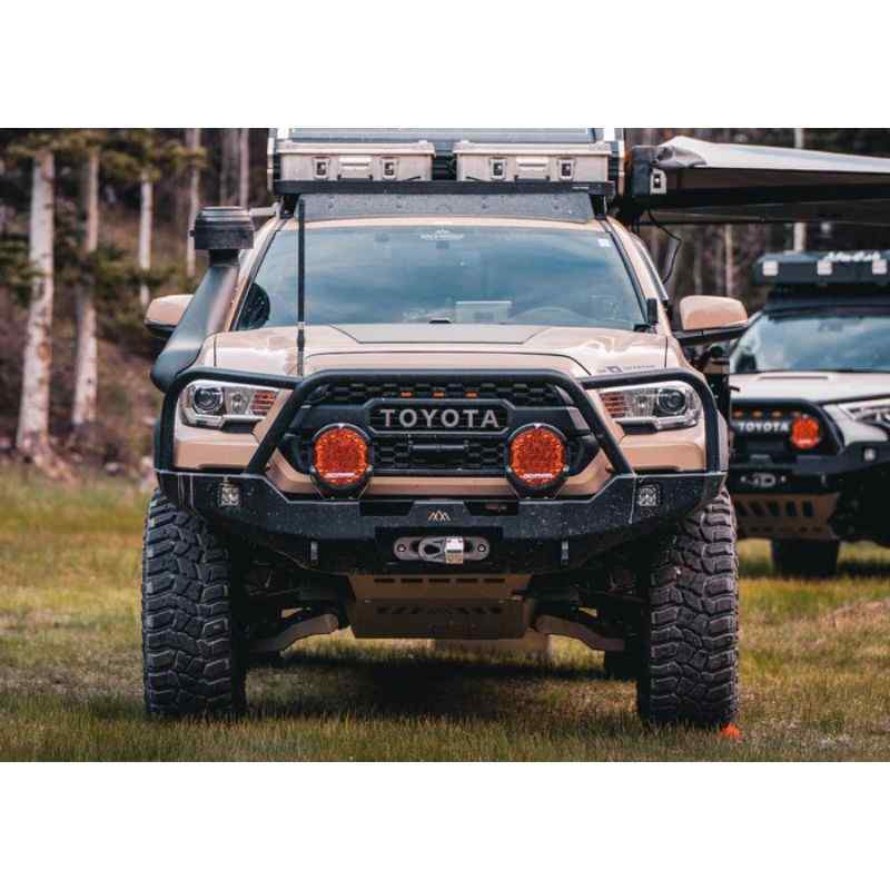 Backwoods Adventure Mods Hi-Lite Overland Front Bumper [Bull Bar] for Toyota Tacoma (3rd Gen) Eye level view of bumper on Tacoma on grass