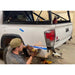 Backwoods Adventure Mods Hi-Lite High Clearance Rear Bumper for Toyota Tacoma (3rd Gen) Person installing bumper 