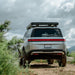 Badass Tents "RUGGED" Rooftop Tent (Universal Fit) Rear view of closed tent on vehicle on trail