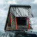 Badass Tents "RUGGED" Rooftop Tent (Universal Fit). Rear corner view of open tent on vehicle outside