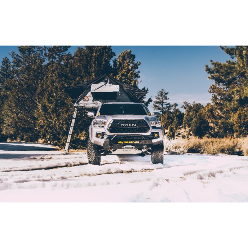 Body Armor 4X4 Sky Ridge Pike Soft Shell Rooftop Tent (2 Person). Front view of open tent with ladder on truck on white background