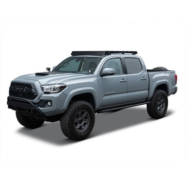 Front Runner Toyota Tacoma (2005-Current) Slimsport Roof Rack Kit. Front angled view of roof rack on vehicle on white background