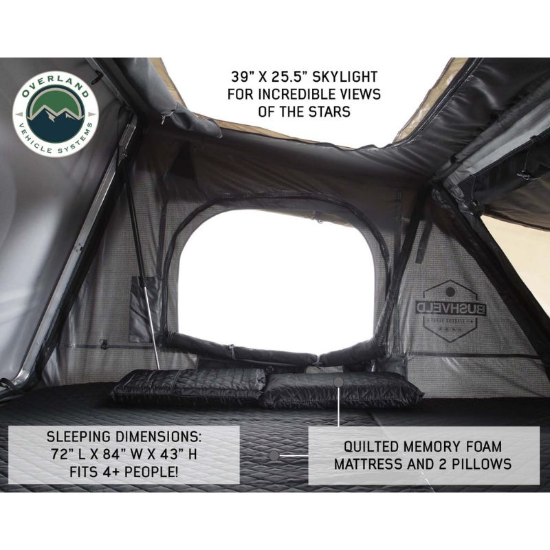 Overland Vehicle Systems Bushveld II 2+ Person Hard Shell Roof Top Tent Inside view of tent showing mattress and skylight