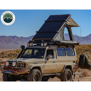 Overland Vehicle Systems Mamba III Hard Shell Roof Top Tent Open tent on vehicle in mountains