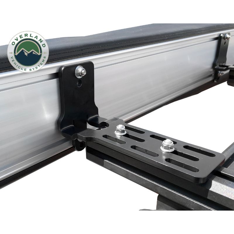 Overland Vehicle Systems Nomadic Awning 180 - Dark Gray With Black Cover close up of mounting hardware on white background