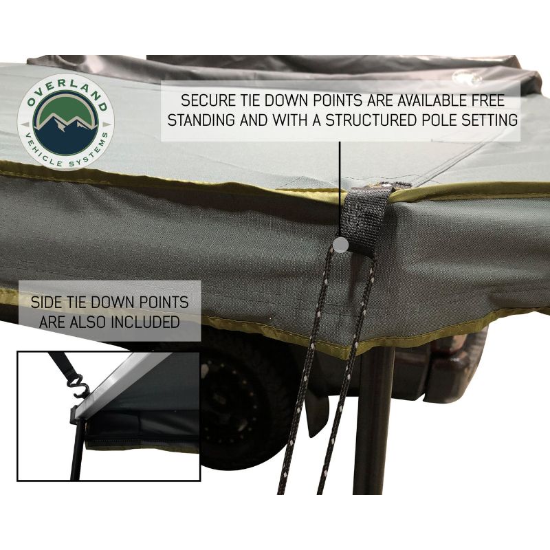 Overland Vehicle Systems Nomadic Awning 180 - Dark Gray With Black Cover close up of tie down points on white background