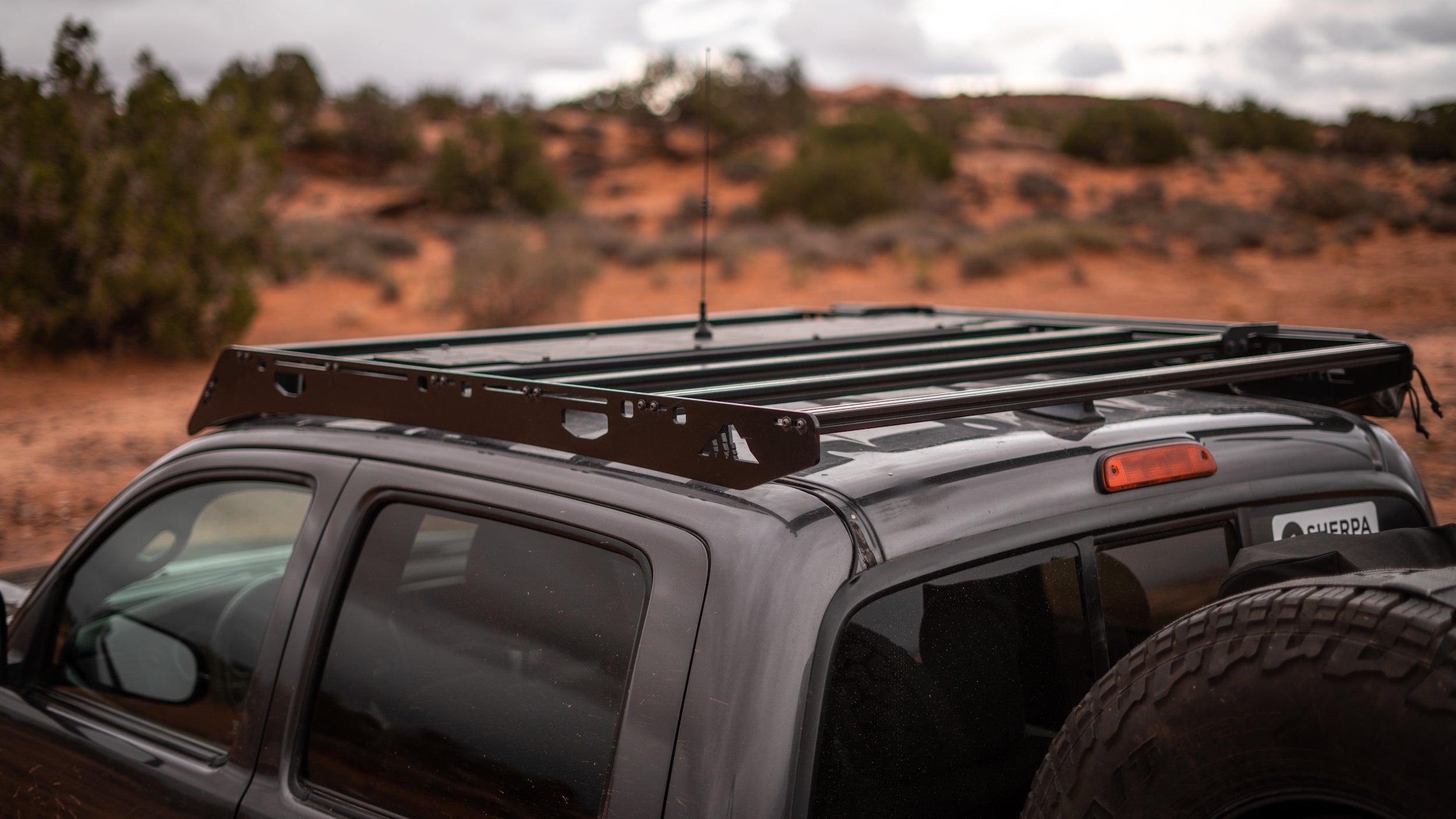 2nd/3rd Gen Toyota Tacoma Roof Rack Rear corner close up of rack on vehicle outside