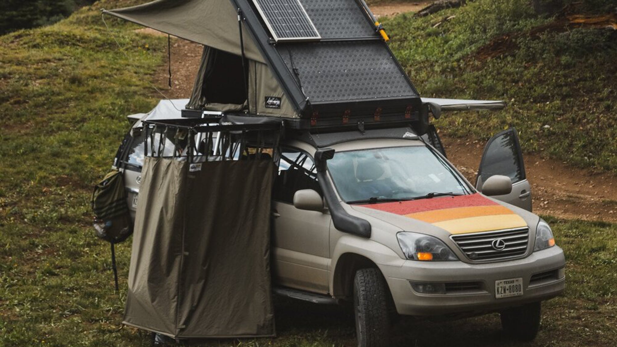 Lexus GX470 Roof Rack Angled view of rack on vehicle with open tent on it at campsite