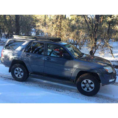 Front Runner Toyota 4Runner (4th Gen) Slimline II Roof Rack Kit Side view of Roof rack on vehicle on trail