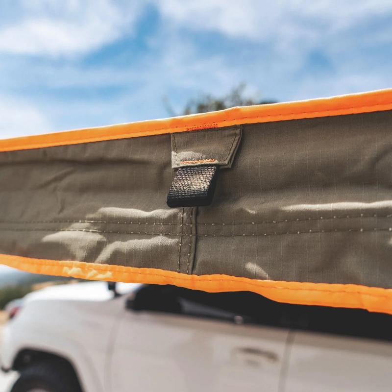 Tuff Stuff Overland 180 Degree Awning, XL, Driver or Passenger Side, C-Channel Aluminum, Olive close up side on vehicle outdoors