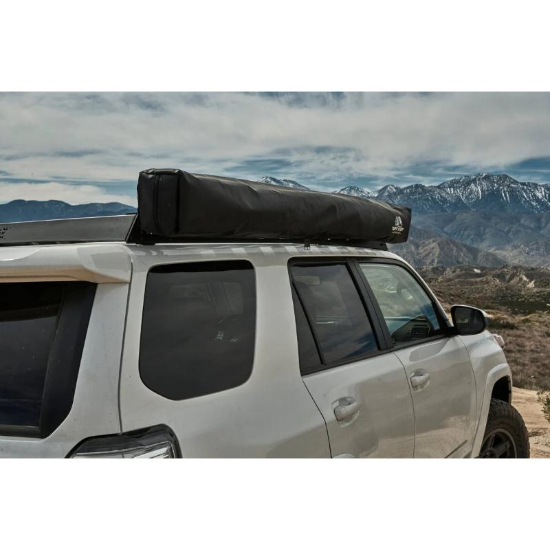 Tuff Stuff Overland 270 Degree Awning, Compact, Driver Side, C-Channel Aluminum, Olive closed on vehicle outdoors  