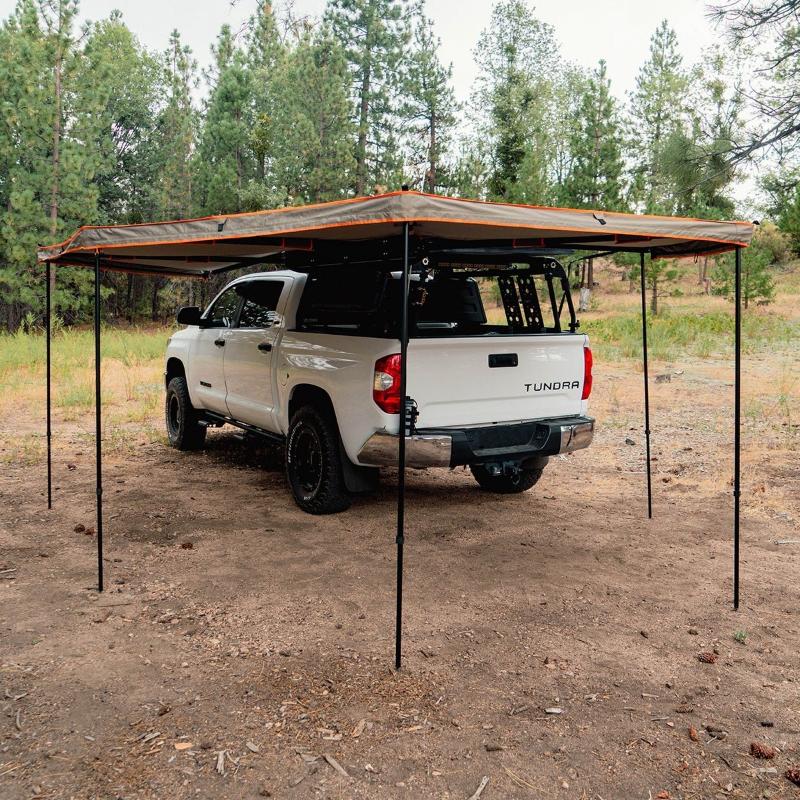 Tuff Stuff Overland 270 Degree Awning, XL, Driver Side, C-Channel Aluminum, Olive assembled with poles outdoors