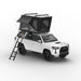 Tuff Stuff Overland Alpine 51 Hard Shell (Aluminum) Roof Top Tent. Open tent with ladder on vehicle on white background