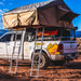 Tuff Stuff Overland Elite Soft Shell Rooftop Tent & Annex Room (5 Person). Back corner view of open tent on vehicle with two ladders 