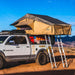 Tuff Stuff Overland Elite Soft Shell Rooftop Tent & Annex Room (5 Person). Side view of open tent on vehicle with two ladders