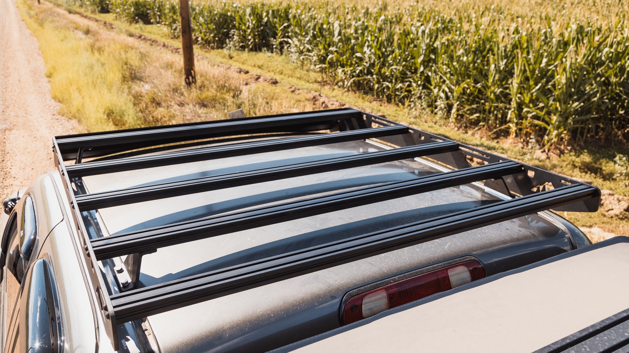 1st Gen Toyota Tundra Roof Rack Close up top view of rack on vehicle outside showing crossbars