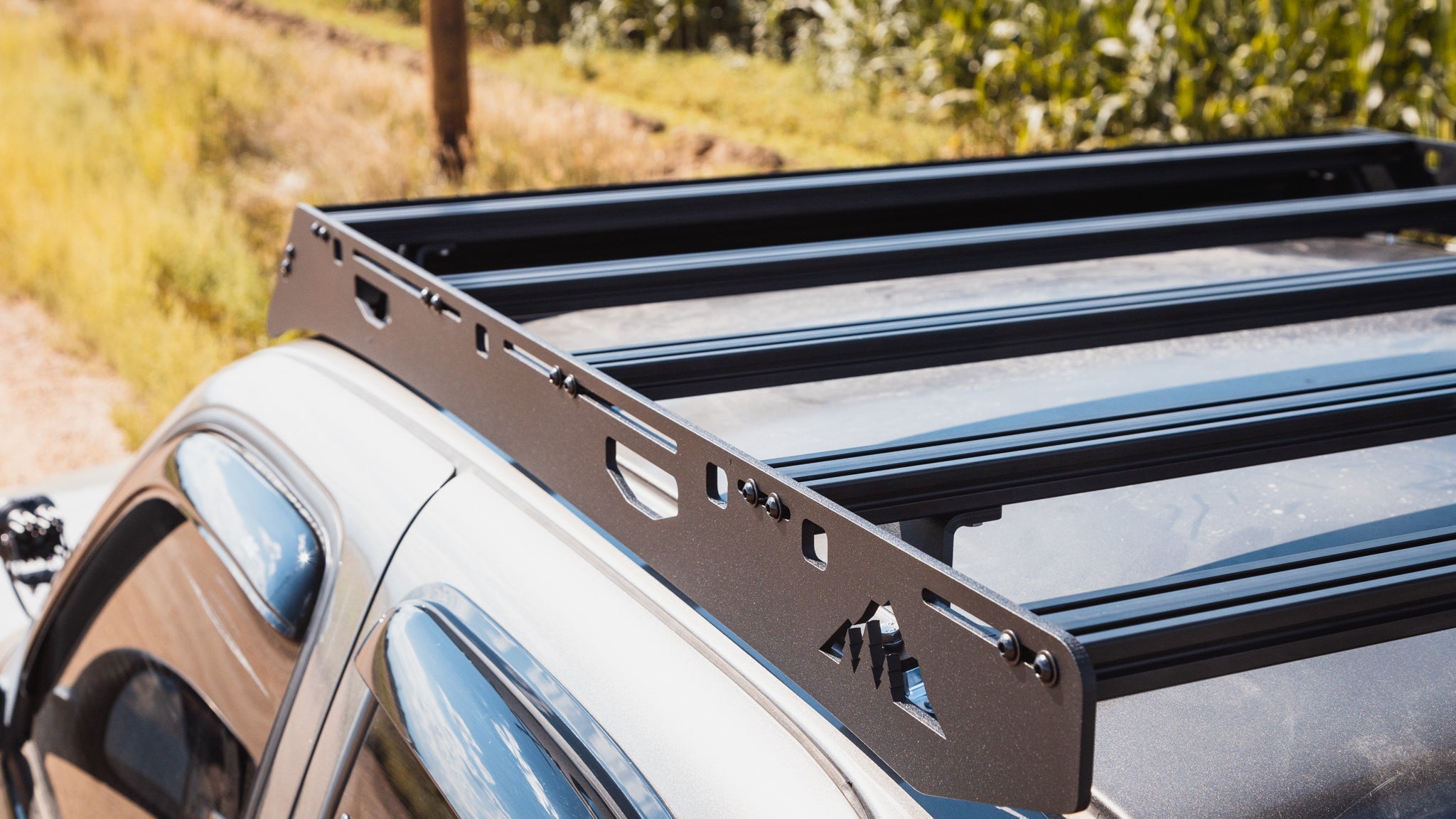 1st Gen Toyota Tundra Roof Rack Close up top view of rack on vehicle outside showing crossbars and finish