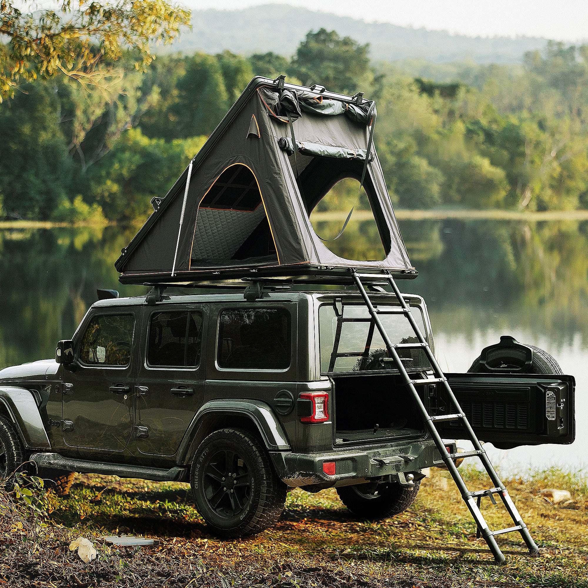 Trustmade Scout Plus Series - Triangular Hard Shell Rooftop Tent with Roof Rack assembled on truck with ladder at lake 2