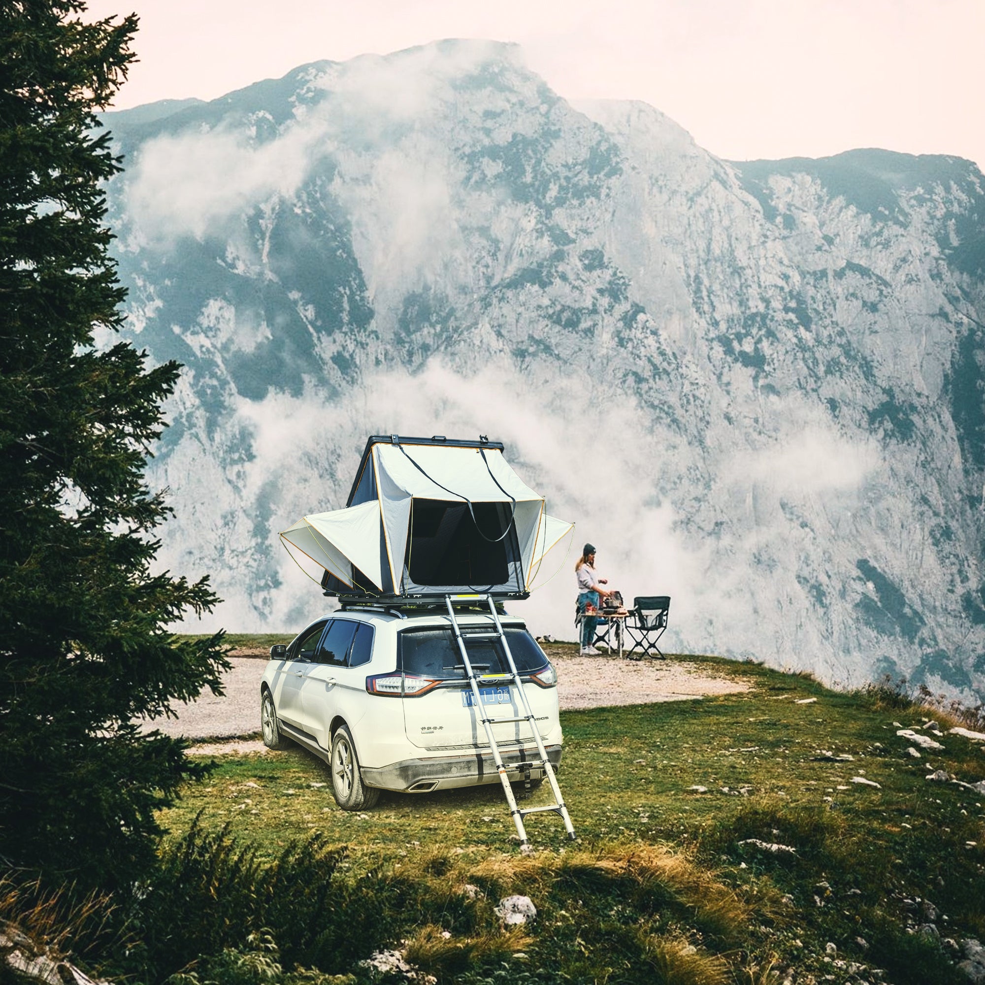 Trustmade Scout Pro Series - Triangular Hard Shell Rooftop Tent open at mountains on vehicle