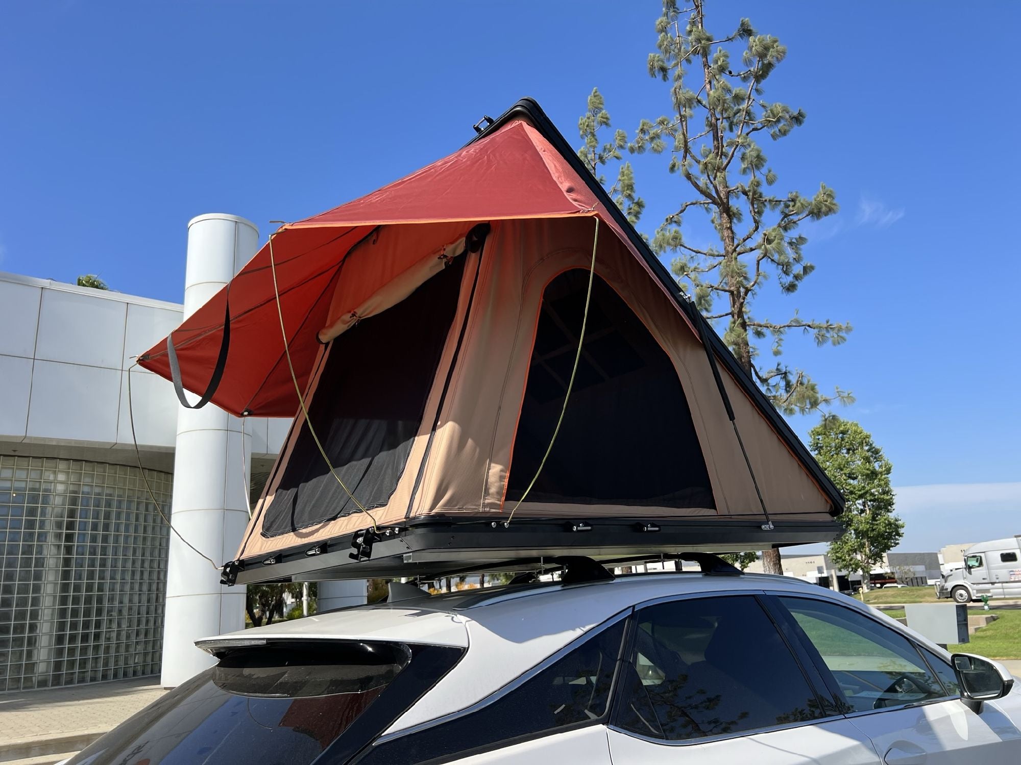 Trustmade Scout MAX Series - Triangular Hard Shell Rooftop Tent assembled on suv corner view outside